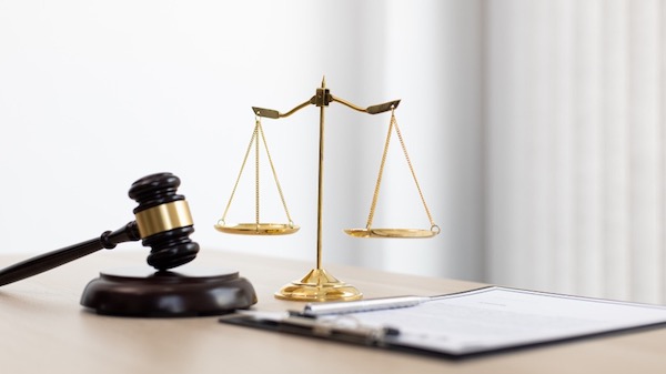 Judge’s gavel and justice scales on a desk