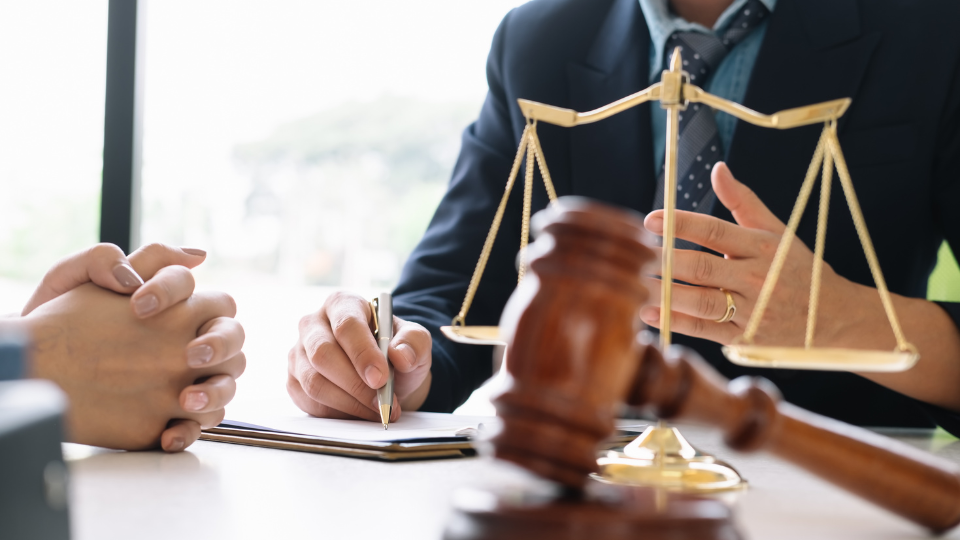  A gavel and justice scales on a table